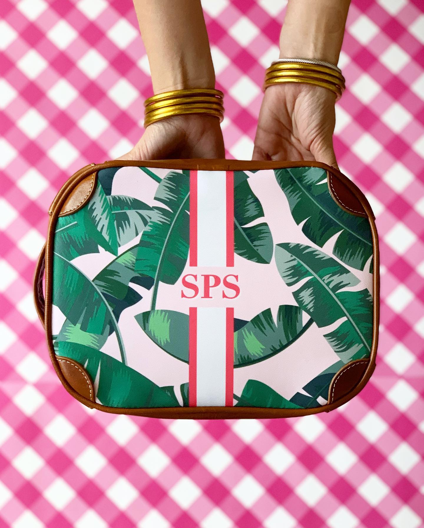 Monogrammed Tropical Leaf Design Cosmetic Bag Held in Hands